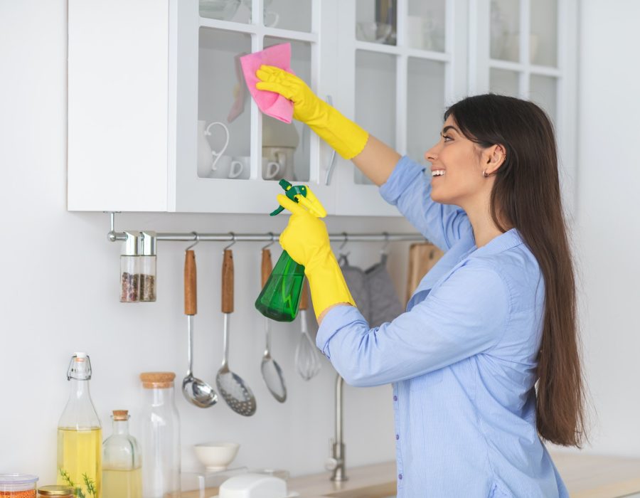 young-woman-cleaning-shelfs-at-home-at-kitchen.jpg young-woman-cleaning-shelfs-at-home-at-kitchen.jpg